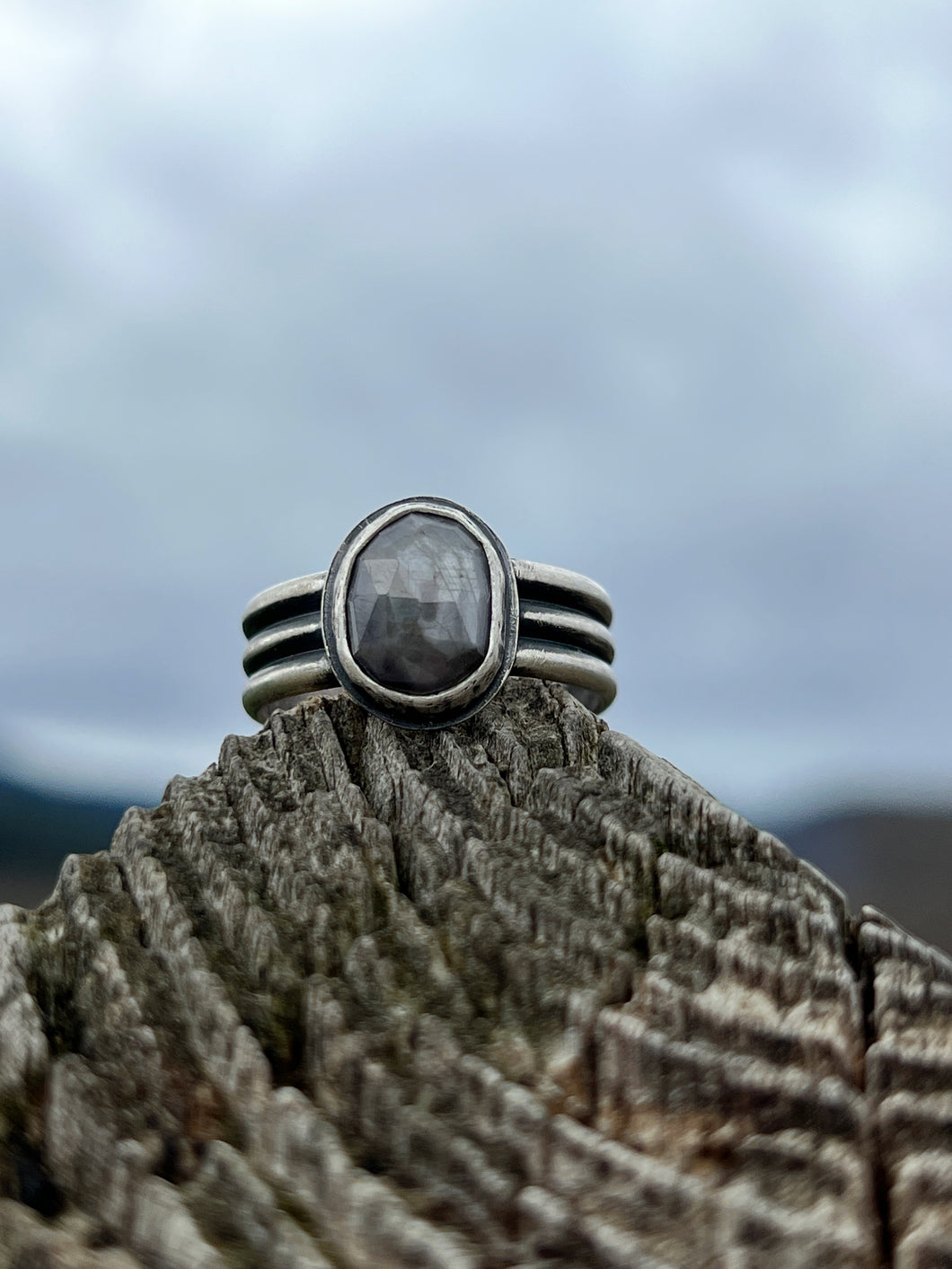 Rosecut grey star sapphire with triple wire band ring