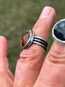 Orange kyanite with a triple wire band ring